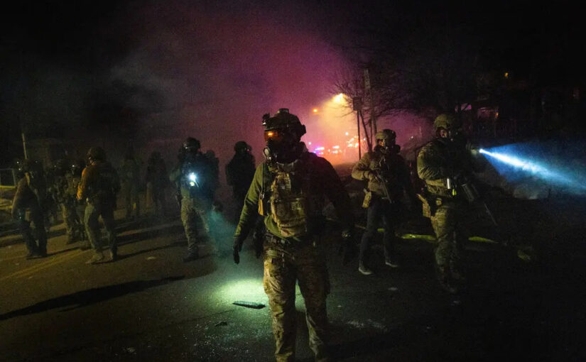 U.S. federal agents, including ICE, during an operation in Minneapolis, in January. Credit...David Guttenfelder/The New York Times